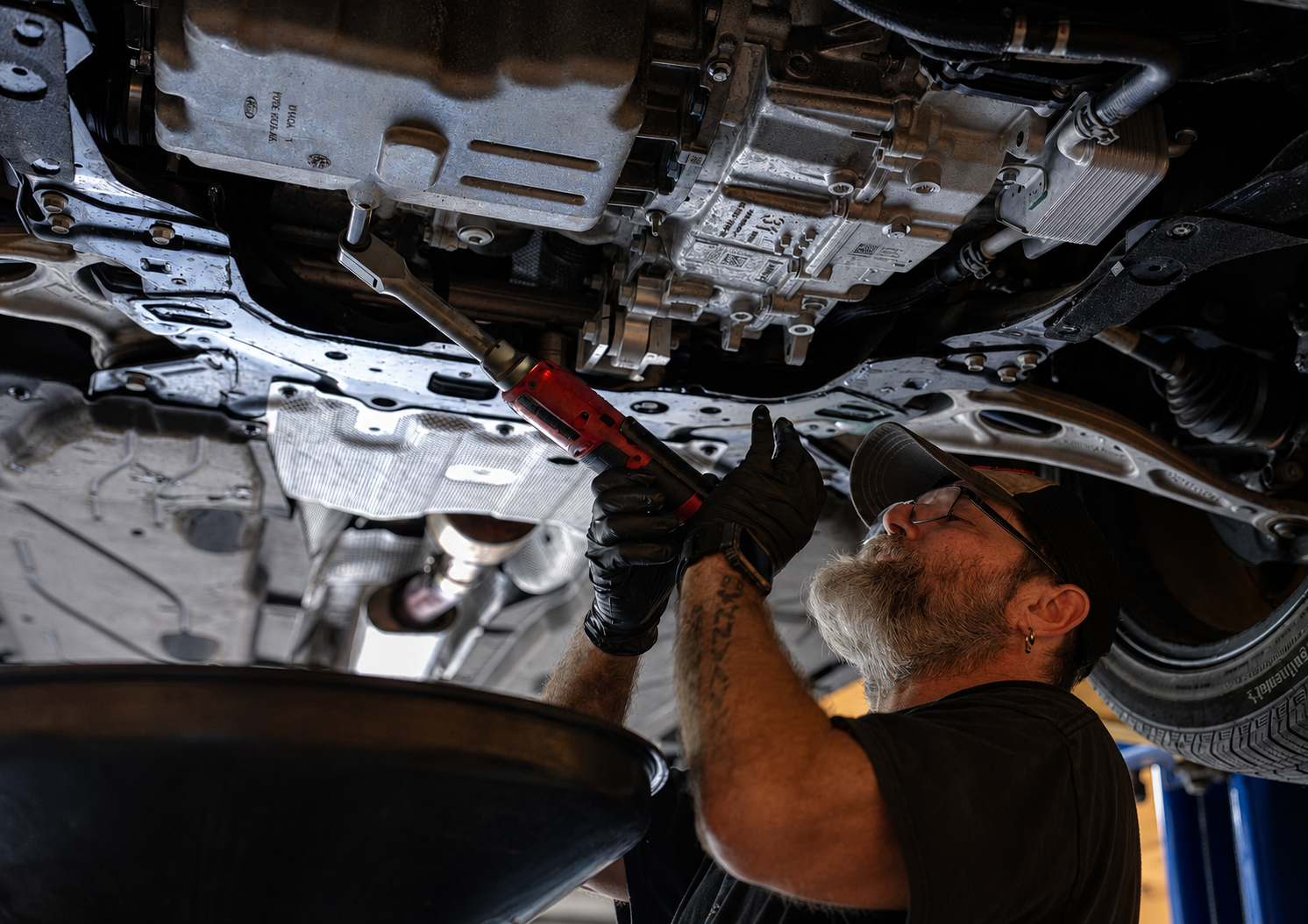 Choice Tire & Automotive technician performing an under-vehicle service